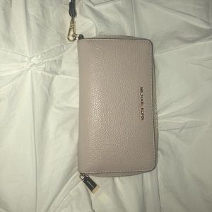 A Michael Kors Mercer large leather phone wristlet